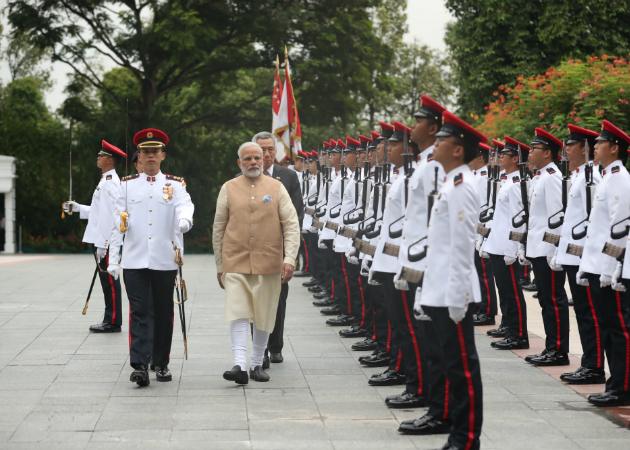 PM Modi inspecting the guard of honour at the Istana.